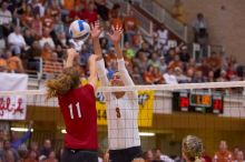 UT junior Lauren Paolini (#3, UTIL) blocks a hit by Nebraska senior Tracy Stalls (#11, MB).  The Longhorns defeated the Huskers 3-0 on Wednesday night, October 24, 2007 at Gregory Gym.

Filename: SRM_20071024_1931585.jpg
Aperture: f/4.0
Shutter Speed: 1/400
Body: Canon EOS-1D Mark II
Lens: Canon EF 80-200mm f/2.8 L