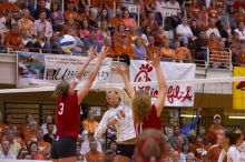 UT sophomore Ashley Engle (#10, S/RS) hits the ball past blockers Nebraska senior Christina Houghtelling (#3, OH) and Nebraska senior Tracy Stalls (#11, MB).  The Longhorns defeated the Huskers 3-0 on Wednesday night, October 24, 2007 at Gregory Gym.

Filename: SRM_20071024_1932083.jpg
Aperture: f/4.0
Shutter Speed: 1/400
Body: Canon EOS-1D Mark II
Lens: Canon EF 80-200mm f/2.8 L