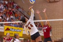 UT senior Brandy Magee (#44, MB) spikes past Nebraska junior Jordan Larson (#10, OH) as UT senior Michelle Moriarty (#4, S) watches.  The Longhorns defeated the Huskers 3-0 on Wednesday night, October 24, 2007 at Gregory Gym.

Filename: SRM_20071024_1950061.jpg
Aperture: f/4.0
Shutter Speed: 1/320
Body: Canon EOS-1D Mark II
Lens: Canon EF 80-200mm f/2.8 L