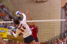 UT senior Brandy Magee (#44, MB) spikes past Nebraska junior Jordan Larson (#10, OH) as UT senior Michelle Moriarty (#4, S) watches.  The Longhorns defeated the Huskers 3-0 on Wednesday night, October 24, 2007 at Gregory Gym.

Filename: SRM_20071024_1950082.jpg
Aperture: f/4.0
Shutter Speed: 1/320
Body: Canon EOS-1D Mark II
Lens: Canon EF 80-200mm f/2.8 L