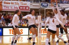 UT junior Kiley Hall (#11, DS/L), UT freshman Juliann Faucette (#1, OH), UT senior Michelle Moriarty (#4, S), UT junior Lauren Paolini (#3, UTIL) and UT sophomore Destinee Hooker (#21, OH) are ecstatic after a point.  The Longhorns defeated the Huskers 3-0

Filename: SRM_20071024_1954542.jpg
Aperture: f/4.0
Shutter Speed: 1/400
Body: Canon EOS-1D Mark II
Lens: Canon EF 80-200mm f/2.8 L