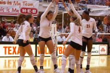 UT junior Kiley Hall (#11, DS/L), UT freshman Juliann Faucette (#1, OH), UT senior Michelle Moriarty (#4, S), UT junior Lauren Paolini (#3, UTIL) and UT sophomore Destinee Hooker (#21, OH) are ecstatic after a point.  The Longhorns defeated the Huskers 3-0

Filename: SRM_20071024_1954564.jpg
Aperture: f/4.0
Shutter Speed: 1/400
Body: Canon EOS-1D Mark II
Lens: Canon EF 80-200mm f/2.8 L