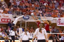 UT sophomore Destinee Hooker (#21, OH) spikes the ball, as UT senior Alyson Jennings (#16, L), UT sophomore Ashley Engle (#10, S/RS) and UT senior Michelle Moriarty (#4, S) watch and Nebraska senior Sarah Pavan (#9, RS) and Nebraska senior Tracy Stalls (#1

Filename: SRM_20071024_1956104.jpg
Aperture: f/4.0
Shutter Speed: 1/400
Body: Canon EOS-1D Mark II
Lens: Canon EF 80-200mm f/2.8 L