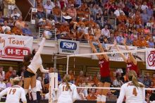 UT freshman Juliann Faucette (#1, OH) hits the ball past blockers Nebraska senior Sarah Pavan (#9, RS) and Nebraska sophomore Kori Cooper (#15, MB) as UT sophomore Heather Kisner (#19, DS), UT sophomore Ashley Engle (#10, S/RS) and UT senior Michelle Moria

Filename: SRM_20071024_2004443.jpg
Aperture: f/4.0
Shutter Speed: 1/320
Body: Canon EOS-1D Mark II
Lens: Canon EF 80-200mm f/2.8 L