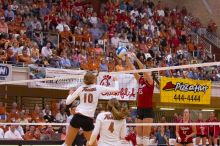 Nebraska sophomore Kori Cooper (#15, MB) blocks a hit by UT sophomore Ashley Engle (#10, S/RS) as UT senior Michelle Moriarty (#4, S) and Nebraska sophomore Rachel Holloway (#12, S) watch.  The Longhorns defeated the Huskers 3-0 on Wednesday night, October

Filename: SRM_20071024_2005307.jpg
Aperture: f/4.0
Shutter Speed: 1/320
Body: Canon EOS-1D Mark II
Lens: Canon EF 80-200mm f/2.8 L