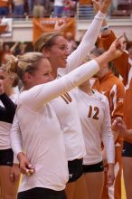 UT sophomore Heather Kisner (#19, DS), UT sophomore Ashley Engle (#10, S/RS) and UT freshman Alexandra Lewis (#12, DS) celebrate their win over Nebraska.  The Longhorns defeated the Huskers 3-0 on Wednesday night, October 24, 2007 at Gregory Gym.

Filename: SRM_20071024_2015028.jpg
Aperture: f/4.0
Shutter Speed: 1/250
Body: Canon EOS-1D Mark II
Lens: Canon EF 80-200mm f/2.8 L