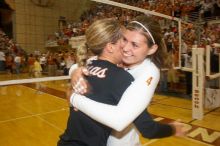 UT senior Alyson Jennings (#16, L) hugs UT senior Michelle Moriarty (#4, S) to celebrate their win over Nebraska.  The Longhorns defeated the Huskers 3-0 on Wednesday night, October 24, 2007 at Gregory Gym.

Filename: SRM_20071024_2016324.jpg
Aperture: f/5.6
Shutter Speed: 1/100
Body: Canon EOS 20D
Lens: Canon EF-S 18-55mm f/3.5-5.6