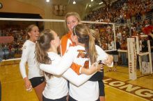 UT senior Alyson Jennings (#16, L) hugs UT senior Michelle Moriarty (#4, S) and UT junior Kiley Hall (#11, DS/L) to celebrate their win over Nebraska.  The Longhorns defeated the Huskers 3-0 on Wednesday night, October 24, 2007 at Gregory Gym.

Filename: SRM_20071024_2016366.jpg
Aperture: f/5.6
Shutter Speed: 1/100
Body: Canon EOS 20D
Lens: Canon EF-S 18-55mm f/3.5-5.6