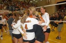 UT senior Alyson Jennings (#16, L) hugs UT senior Michelle Moriarty (#4, S) and UT junior Kiley Hall (#11, DS/L) to celebrate their win over Nebraska.  The Longhorns defeated the Huskers 3-0 on Wednesday night, October 24, 2007 at Gregory Gym.

Filename: SRM_20071024_2016387.jpg
Aperture: f/5.6
Shutter Speed: 1/100
Body: Canon EOS 20D
Lens: Canon EF-S 18-55mm f/3.5-5.6