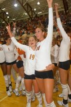 UT sophomore Heather Kisner (#19, DS) embraces UT sophomore Ashley Engle (#10, S/RS) to celebrate their win over Nebraska.  The Longhorns defeated the Huskers 3-0 on Wednesday night, October 24, 2007 at Gregory Gym.

Filename: SRM_20071024_2017183.jpg
Aperture: f/5.6
Shutter Speed: 1/100
Body: Canon EOS 20D
Lens: Canon EF-S 18-55mm f/3.5-5.6