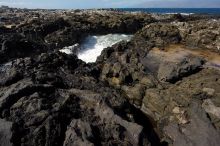 Hike to the Nakalele blowholes along the surf-beaten lava formations.

Filename: SRM_20071219_1229470.jpg
Aperture: f/8.0
Shutter Speed: 1/2500
Body: Canon EOS-1D Mark II
Lens: Sigma 15-30mm f/3.5-4.5 EX Aspherical DG DF