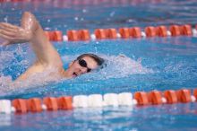 UT junior Michael Klueh won the 1000 yard freestyle with a time of 9:01.89.  The University of Texas Longhorns defeated The University of Georgia Bulldogs 157-135 on Saturday, January 12, 2008.

Filename: SRM_20080112_1107580.jpg
Aperture: f/2.8
Shutter Speed: 1/400
Body: Canon EOS-1D Mark II
Lens: Canon EF 300mm f/2.8 L IS