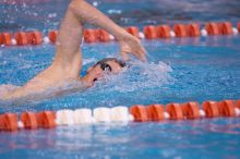 UT junior Michael Klueh won the 1000 yard freestyle with a time of 9:01.89.  The University of Texas Longhorns defeated The University of Georgia Bulldogs 157-135 on Saturday, January 12, 2008.

Filename: SRM_20080112_1108001.jpg
Aperture: f/2.8
Shutter Speed: 1/400
Body: Canon EOS-1D Mark II
Lens: Canon EF 300mm f/2.8 L IS