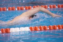 UT junior Michael Klueh won the 1000 yard freestyle with a time of 9:01.89.  The University of Texas Longhorns defeated The University of Georgia Bulldogs 157-135 on Saturday, January 12, 2008.

Filename: SRM_20080112_1108002.jpg
Aperture: f/2.8
Shutter Speed: 1/400
Body: Canon EOS-1D Mark II
Lens: Canon EF 300mm f/2.8 L IS