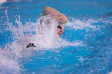 UT junior Michael Klueh won the 1000 yard freestyle with a time of 9:01.89.  The University of Texas Longhorns defeated The University of Georgia Bulldogs 157-135 on Saturday, January 12, 2008.

Filename: SRM_20080112_1110083.jpg
Aperture: f/2.8
Shutter Speed: 1/400
Body: Canon EOS-1D Mark II
Lens: Canon EF 300mm f/2.8 L IS