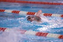 UT junior Michael Klueh won the 1000 yard freestyle with a time of 9:01.89.  The University of Texas Longhorns defeated The University of Georgia Bulldogs 157-135 on Saturday, January 12, 2008.

Filename: SRM_20080112_1111146.jpg
Aperture: f/2.8
Shutter Speed: 1/400
Body: Canon EOS-1D Mark II
Lens: Canon EF 300mm f/2.8 L IS