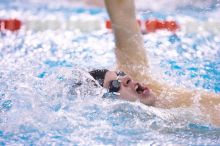 UT sophomore Alan Maher competed in the second heat of the 100 yard backstroke with a time of 51.88.  The University of Texas Longhorns defeated The University of Georgia Bulldogs 157-135 on Saturday, January 12, 2008.

Filename: SRM_20080112_1120542.jpg
Aperture: f/2.8
Shutter Speed: 1/400
Body: Canon EOS-1D Mark II
Lens: Canon EF 300mm f/2.8 L IS