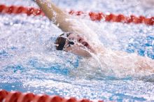 UT sophomore Alan Maher competed in the second heat of the 100 yard backstroke with a time of 51.88.  The University of Texas Longhorns defeated The University of Georgia Bulldogs 157-135 on Saturday, January 12, 2008.

Filename: SRM_20080112_1121041.jpg
Aperture: f/2.8
Shutter Speed: 1/400
Body: Canon EOS-1D Mark II
Lens: Canon EF 300mm f/2.8 L IS