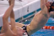 UT senior Daniel Rohleder took first in the 100 yard backstroke with a time of 9:11.44.  The University of Texas Longhorns defeated The University of Georgia Bulldogs 157-135 on Saturday, January 12, 2008.

Filename: SRM_20080112_1122260.jpg
Aperture: f/2.8
Shutter Speed: 1/400
Body: Canon EOS-1D Mark II
Lens: Canon EF 300mm f/2.8 L IS