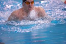 UT senior Agustin Magruder took second in the 100 yard breaststroke with a time of 56.67.  The University of Texas Longhorns defeated The University of Georgia Bulldogs 157-135 on Saturday, January 12, 2008.

Filename: SRM_20080112_1124322.jpg
Aperture: f/2.8
Shutter Speed: 1/400
Body: Canon EOS-1D Mark II
Lens: Canon EF 300mm f/2.8 L IS