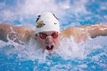 Georgia's Mark Dylla took third in the 200 yard butterfly with a time of 1:49.61.  The University of Texas Longhorns defeated The University of Georgia Bulldogs 157-135 on Saturday, January 12, 2008.

Filename: SRM_20080112_1126521.jpg
Aperture: f/2.8
Shutter Speed: 1/400
Body: Canon EOS-1D Mark II
Lens: Canon EF 300mm f/2.8 L IS