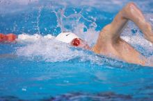 Georgia's Sebastien Rouault took second in the 500 yard freestyle with a time of 4:29.17.  The University of Texas Longhorns defeated The University of Georgia Bulldogs 157-135 on Saturday, January 12, 2008.

Filename: SRM_20080112_1205024.jpg
Aperture: f/2.8
Shutter Speed: 1/400
Body: Canon EOS-1D Mark II
Lens: Canon EF 300mm f/2.8 L IS