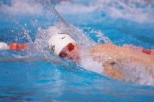 Georgia's Sebastien Rouault took second in the 500 yard freestyle with a time of 4:29.17.  The University of Texas Longhorns defeated The University of Georgia Bulldogs 157-135 on Saturday, January 12, 2008.

Filename: SRM_20080112_1205045.jpg
Aperture: f/2.8
Shutter Speed: 1/400
Body: Canon EOS-1D Mark II
Lens: Canon EF 300mm f/2.8 L IS