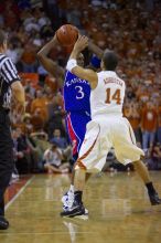 UT sophomore D.J. Augustin (#14, G) guards KU senior Russell Robinson (#3, Guard).  The University of Texas (UT) Longhorns defeated the University of Kansas Jayhawks 72-69 in Austin, Texas on Monday, February 11, 2008.

Filename: SRM_20080211_2011247.jpg
Aperture: f/2.8
Shutter Speed: 1/640
Body: Canon EOS-1D Mark II
Lens: Canon EF 80-200mm f/2.8 L