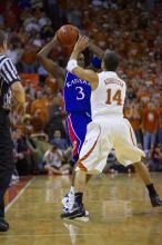 UT sophomore D.J. Augustin (#14, G) guards KU senior Russell Robinson (#3, Guard).  The University of Texas (UT) Longhorns defeated the University of Kansas Jayhawks 72-69 in Austin, Texas on Monday, February 11, 2008.

Filename: SRM_20080211_2011247.jpg
Aperture: f/2.8
Shutter Speed: 1/640
Body: Canon EOS-1D Mark II
Lens: Canon EF 80-200mm f/2.8 L