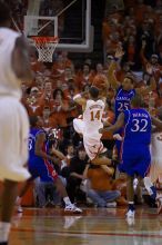 UT sophomore D.J. Augustin (#14, G) shoots over KU senior Russell Robinson (#3, Guard).  The University of Texas (UT) Longhorns defeated the University of Kansas Jayhawks 72-69 in Austin, Texas on Monday, February 11, 2008.

Filename: SRM_20080211_2012400.jpg
Aperture: f/2.8
Shutter Speed: 1/640
Body: Canon EOS-1D Mark II
Lens: Canon EF 80-200mm f/2.8 L