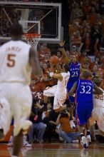 UT sophomore D.J. Augustin (#14, G) shoots over KU senior Russell Robinson (#3, Guard) and KU junior Brandon Rush (#25, Guard).  The University of Texas (UT) Longhorns defeated the University of Kansas Jayhawks 72-69 in Austin, Texas on Monday, February 11, 2008.

Filename: SRM_20080211_2012421.jpg
Aperture: f/2.8
Shutter Speed: 1/640
Body: Canon EOS-1D Mark II
Lens: Canon EF 80-200mm f/2.8 L