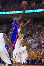 KU senior Darnell Jackson (#32, Forward) goes in for a layup over UT sophomore D.J. Augustin (#14, G).  The University of Texas (UT) Longhorns defeated the University of Kansas Jayhawks 72-69 in Austin, Texas on Monday, February 11, 2008.

Filename: SRM_20080211_2015145.jpg
Aperture: f/2.8
Shutter Speed: 1/640
Body: Canon EOS-1D Mark II
Lens: Canon EF 80-200mm f/2.8 L