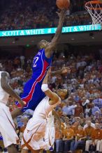 KU senior Darnell Jackson (#32, Forward) goes in for a layup over UT sophomore D.J. Augustin (#14, G).  The University of Texas (UT) Longhorns defeated the University of Kansas Jayhawks 72-69 in Austin, Texas on Monday, February 11, 2008.

Filename: SRM_20080211_2015166.jpg
Aperture: f/2.8
Shutter Speed: 1/640
Body: Canon EOS-1D Mark II
Lens: Canon EF 80-200mm f/2.8 L