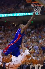 KU senior Darnell Jackson (#32, Forward) goes in for a layup over UT sophomore D.J. Augustin (#14, G).  The University of Texas (UT) Longhorns defeated the University of Kansas Jayhawks 72-69 in Austin, Texas on Monday, February 11, 2008.

Filename: SRM_20080211_2015187.jpg
Aperture: f/2.8
Shutter Speed: 1/640
Body: Canon EOS-1D Mark II
Lens: Canon EF 80-200mm f/2.8 L