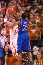 UT sophomore D.J. Augustin (#14, G) attempts a shot as KU junior Brandon Rush (#25, Guard) tries to block.  The University of Texas (UT) Longhorns defeated the University of Kansas Jayhawks 72-69 in Austin, Texas on Monday, February 11, 2008.

Filename: SRM_20080211_2032149.jpg
Aperture: f/2.8
Shutter Speed: 1/640
Body: Canon EOS 20D
Lens: Canon EF 300mm f/2.8 L IS