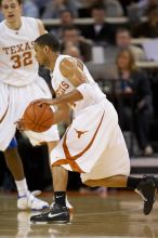 UT junior A.J. Abrams (#3, G) playing defense against a Kansas player.  The University of Texas (UT) Longhorns defeated the University of Kansas Jayhawks 72-69 in Austin, Texas on Monday, February 11, 2008.

Filename: SRM_20080211_2035586.jpg
Aperture: f/2.8
Shutter Speed: 1/640
Body: Canon EOS 20D
Lens: Canon EF 300mm f/2.8 L IS