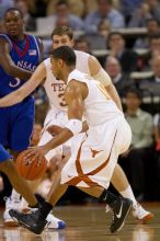 UT junior A.J. Abrams (#3, G) playing defense against a Kansas player.  The University of Texas (UT) Longhorns defeated the University of Kansas Jayhawks 72-69 in Austin, Texas on Monday, February 11, 2008.

Filename: SRM_20080211_2036007.jpg
Aperture: f/2.8
Shutter Speed: 1/640
Body: Canon EOS 20D
Lens: Canon EF 300mm f/2.8 L IS