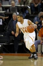 UT junior A.J. Abrams (#3, G) playing defense against a Kansas player.  The University of Texas (UT) Longhorns defeated the University of Kansas Jayhawks 72-69 in Austin, Texas on Monday, February 11, 2008.

Filename: SRM_20080211_2036321.jpg
Aperture: f/2.8
Shutter Speed: 1/640
Body: Canon EOS 20D
Lens: Canon EF 300mm f/2.8 L IS