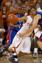 UT sophomore D.J. Augustin (#14, G) runs into a Kansas player during a drive.  The University of Texas (UT) Longhorns defeated the University of Kansas Jayhawks 72-69 in Austin, Texas on Monday, February 11, 2008.

Filename: SRM_20080211_2043427.jpg
Aperture: f/2.8
Shutter Speed: 1/640
Body: Canon EOS 20D
Lens: Canon EF 300mm f/2.8 L IS