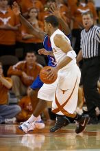 UT junior A.J. Abrams (#3, G) playing defense against a Kansas player.  The University of Texas (UT) Longhorns defeated the University of Kansas Jayhawks 72-69 in Austin, Texas on Monday, February 11, 2008.

Filename: SRM_20080211_2045180.jpg
Aperture: f/2.8
Shutter Speed: 1/640
Body: Canon EOS 20D
Lens: Canon EF 300mm f/2.8 L IS