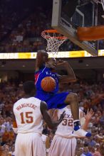 KU senior Darnell Jackson (#32, Forward) dunks over UT freshman Alexis Wangmene (#15, F/C) and UT junior Connor Atchley (#32, F/C).  The University of Texas (UT) Longhorns defeated the University of Kansas Jayhawks 72-69 in Austin, Texas on Monday, February 11, 2008.

Filename: SRM_20080211_2046122.jpg
Aperture: f/2.8
Shutter Speed: 1/640
Body: Canon EOS-1D Mark II
Lens: Canon EF 80-200mm f/2.8 L