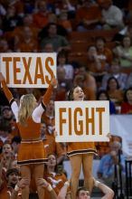 UT Cheerleaders rallying the fans at the Kansas game.  The University of Texas (UT) Longhorns defeated the University of Kansas Jayhawks 72-69 in Austin, Texas on Monday, February 11, 2008.

Filename: SRM_20080211_2052103.jpg
Aperture: f/2.8
Shutter Speed: 1/640
Body: Canon EOS 20D
Lens: Canon EF 300mm f/2.8 L IS