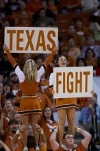 UT Cheerleaders rallying the fans at the Kansas game.  The University of Texas (UT) Longhorns defeated the University of Kansas Jayhawks 72-69 in Austin, Texas on Monday, February 11, 2008.

Filename: SRM_20080211_2052240.jpg
Aperture: f/2.8
Shutter Speed: 1/640
Body: Canon EOS 20D
Lens: Canon EF 300mm f/2.8 L IS