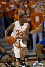 UT sophomore Justin Mason (#24, G).  The University of Texas (UT) Longhorns defeated the University of Kansas Jayhawks 72-69 in Austin, Texas on Monday, February 11, 2008.

Filename: SRM_20080211_2052582.jpg
Aperture: f/2.8
Shutter Speed: 1/640
Body: Canon EOS 20D
Lens: Canon EF 300mm f/2.8 L IS