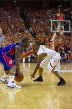 UT junior A.J. Abrams (#3, G) playing defense against a Kansas player.  The University of Texas (UT) Longhorns defeated the University of Kansas Jayhawks 72-69 in Austin, Texas on Monday, February 11, 2008.

Filename: SRM_20080211_2056487.jpg
Aperture: f/2.8
Shutter Speed: 1/640
Body: Canon EOS-1D Mark II
Lens: Canon EF 80-200mm f/2.8 L