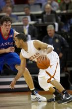 UT junior A.J. Abrams (#3, G) playing defense against a Kansas player.  The University of Texas (UT) Longhorns defeated the University of Kansas Jayhawks 72-69 in Austin, Texas on Monday, February 11, 2008.

Filename: SRM_20080211_2058586.jpg
Aperture: f/2.8
Shutter Speed: 1/640
Body: Canon EOS 20D
Lens: Canon EF 300mm f/2.8 L IS