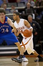 UT junior A.J. Abrams (#3, G) playing defense against a Kansas player.  The University of Texas (UT) Longhorns defeated the University of Kansas Jayhawks 72-69 in Austin, Texas on Monday, February 11, 2008.

Filename: SRM_20080211_2059007.jpg
Aperture: f/2.8
Shutter Speed: 1/640
Body: Canon EOS 20D
Lens: Canon EF 300mm f/2.8 L IS