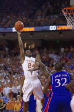 UT sophomore Justin Mason (#24, G) takes a shot over KU sophomore Darrell Arthur (#00, Forward) and KU senior Darnell Jackson (#32, Forward).  The University of Texas (UT) Longhorns defeated the University of Kansas Jayhawks 72-69 in Austin, Texas on Monday, February 11, 2008.

Filename: SRM_20080211_2118222.jpg
Aperture: f/2.8
Shutter Speed: 1/640
Body: Canon EOS-1D Mark II
Lens: Canon EF 80-200mm f/2.8 L