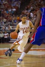 UT junior A.J. Abrams (#3, G) playing defense against a Kansas player.  The University of Texas (UT) Longhorns defeated the University of Kansas Jayhawks 72-69 in Austin, Texas on Monday, February 11, 2008.

Filename: SRM_20080211_2119387.jpg
Aperture: f/2.8
Shutter Speed: 1/640
Body: Canon EOS-1D Mark II
Lens: Canon EF 80-200mm f/2.8 L