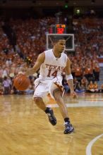 UT junior A.J. Abrams (#3, G) playing defense against a Kansas player.  The University of Texas (UT) Longhorns defeated the University of Kansas Jayhawks 72-69 in Austin, Texas on Monday, February 11, 2008.

Filename: SRM_20080211_2120446.jpg
Aperture: f/2.8
Shutter Speed: 1/640
Body: Canon EOS-1D Mark II
Lens: Canon EF 80-200mm f/2.8 L